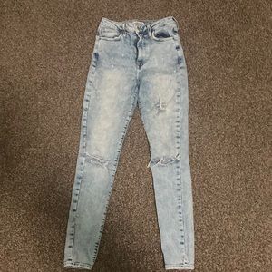Acid wash ripped denim jeans